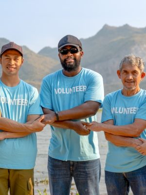 Community engagement initiative: Front View Of Volunteer Team Holding Each Other's Crossed Hands